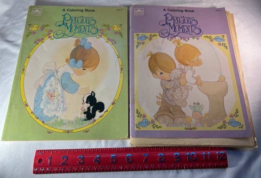 Precious Moments coloring books and loose pages mostly unused. Some yellowing .